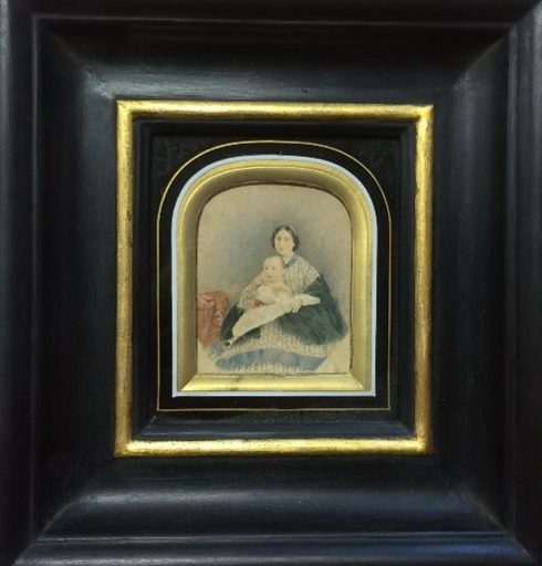 portrait of Hardy as a baby with his mother, in a black gilded frame