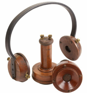 Old-fashioned telephone with headphones and a mouthpiece.