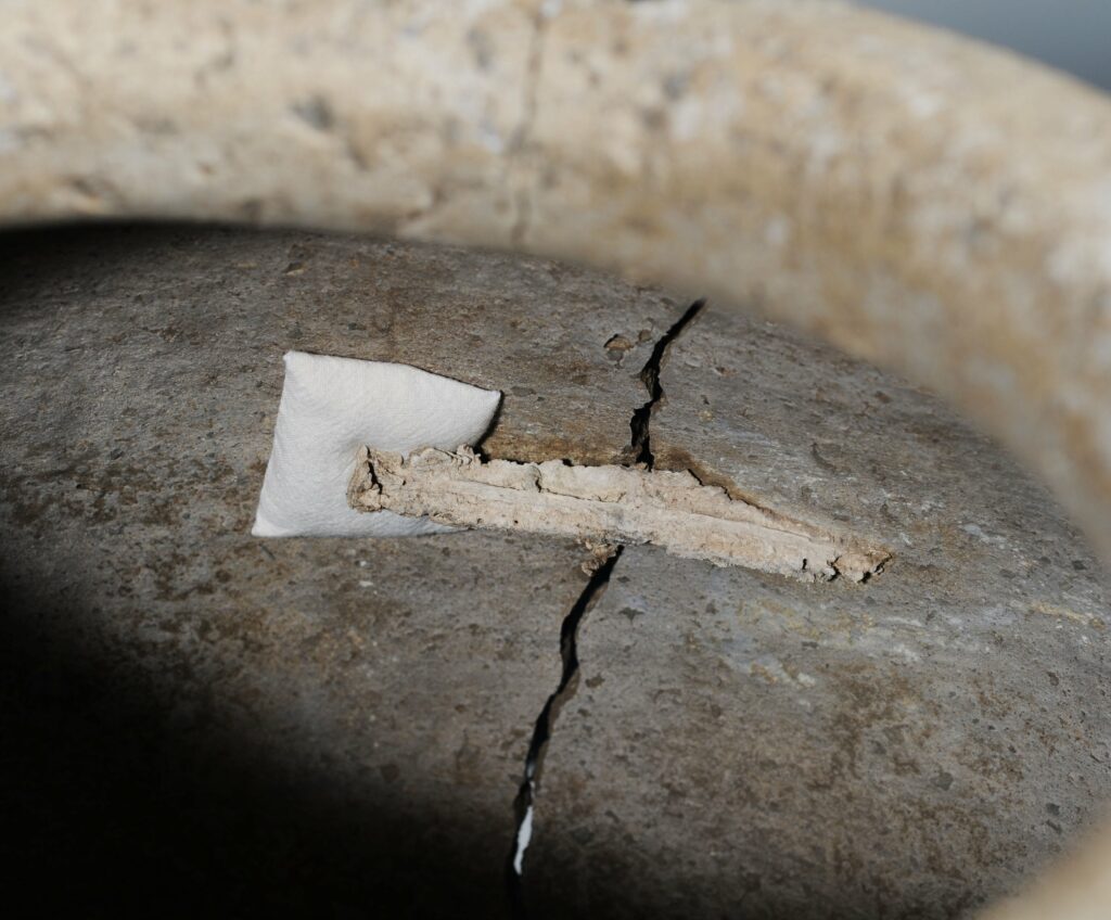 Detail showing the lead staples - Roman Pot 2 & Swindon Museum & Art gallery/ Swindon Borough Council